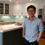 Happy customer Michael Chen, satisfied with his kitchen design