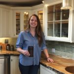 Happy customer Sarah Johnson, satisfied with her kitchen remodel